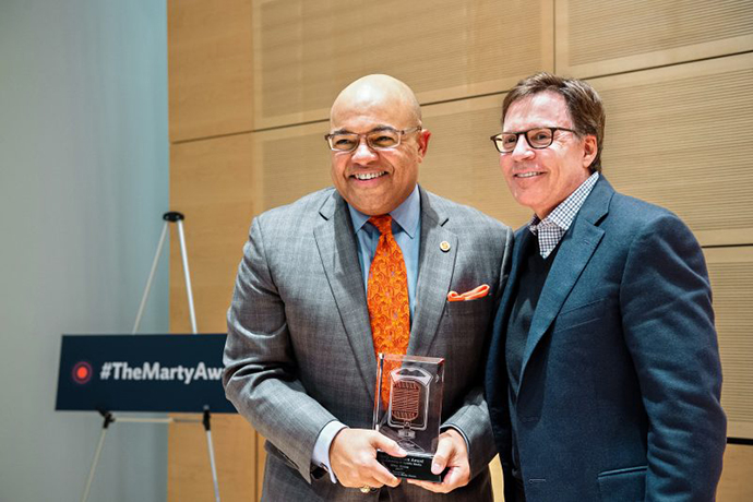 Mike Tirico and Bob Costas at award ceremony